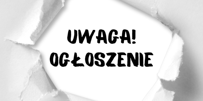 na szarym tle napis uwaga ogłoszenie